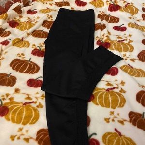 Fabletics black compression leggings with mesh sides